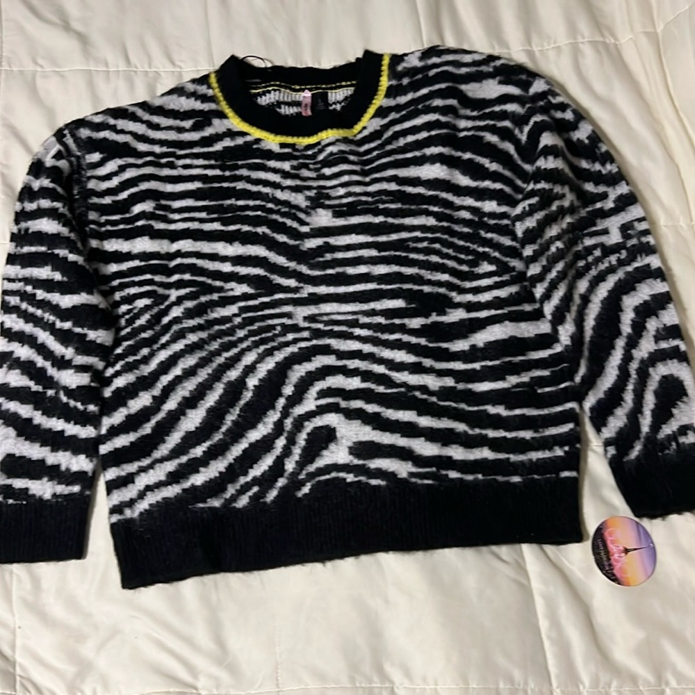 Zebra Print Sweater with yellow trim around the neck